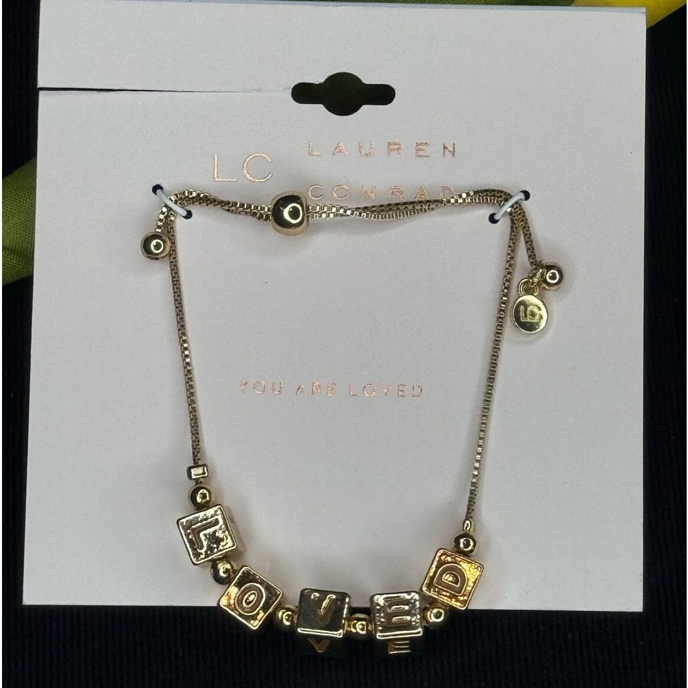 Lauren Conrad Gold Tone Beaded Bracelet with “Loved” in Gold Beads Slide Closure